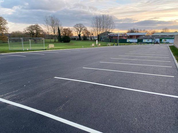Wide expanse of freshly surfaced commercial car park